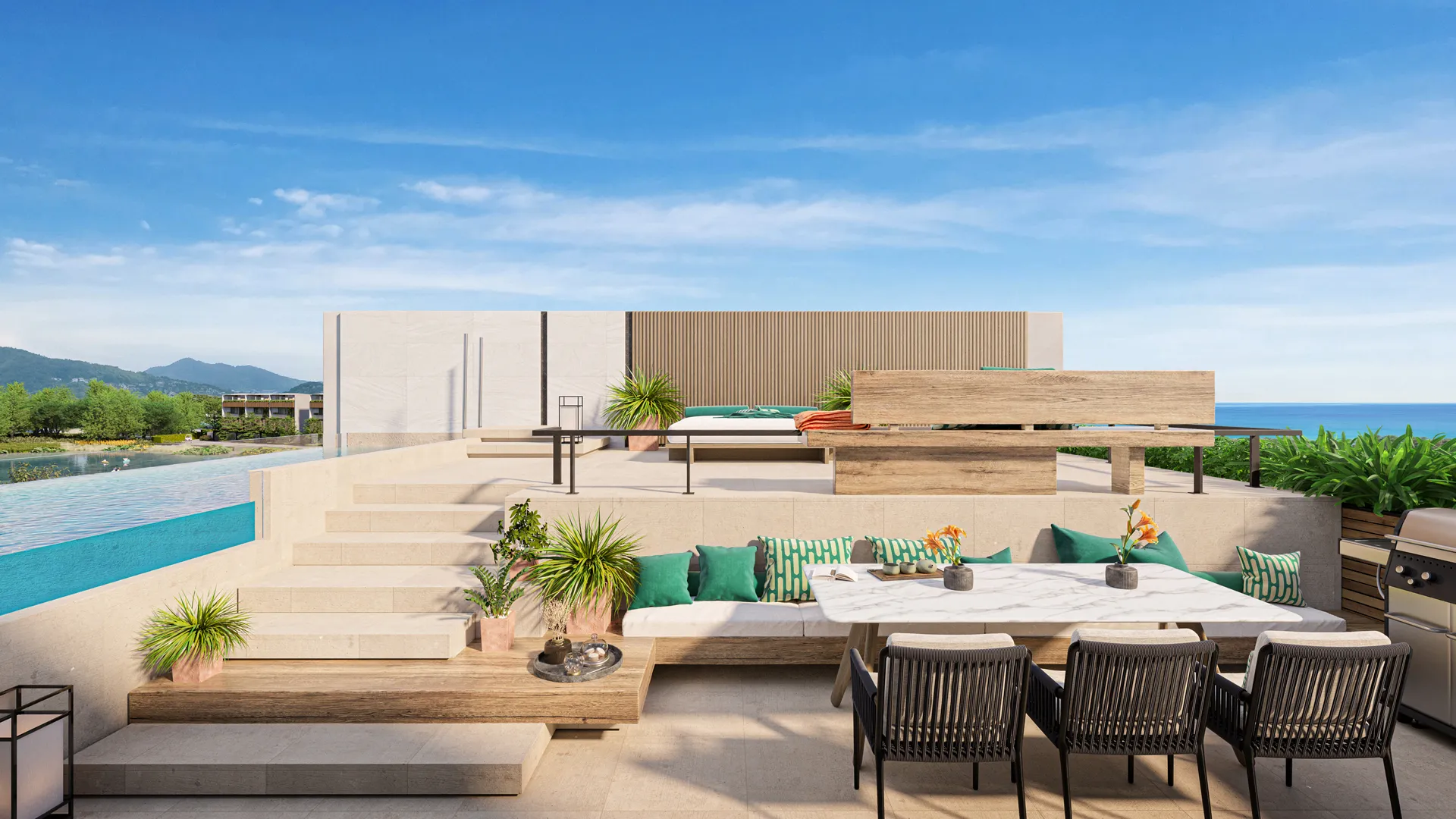 A luxurious terrace with lounge chairs, a tree, and an infinity pool overlooking a tropical beach with palm trees and hills in the distance.