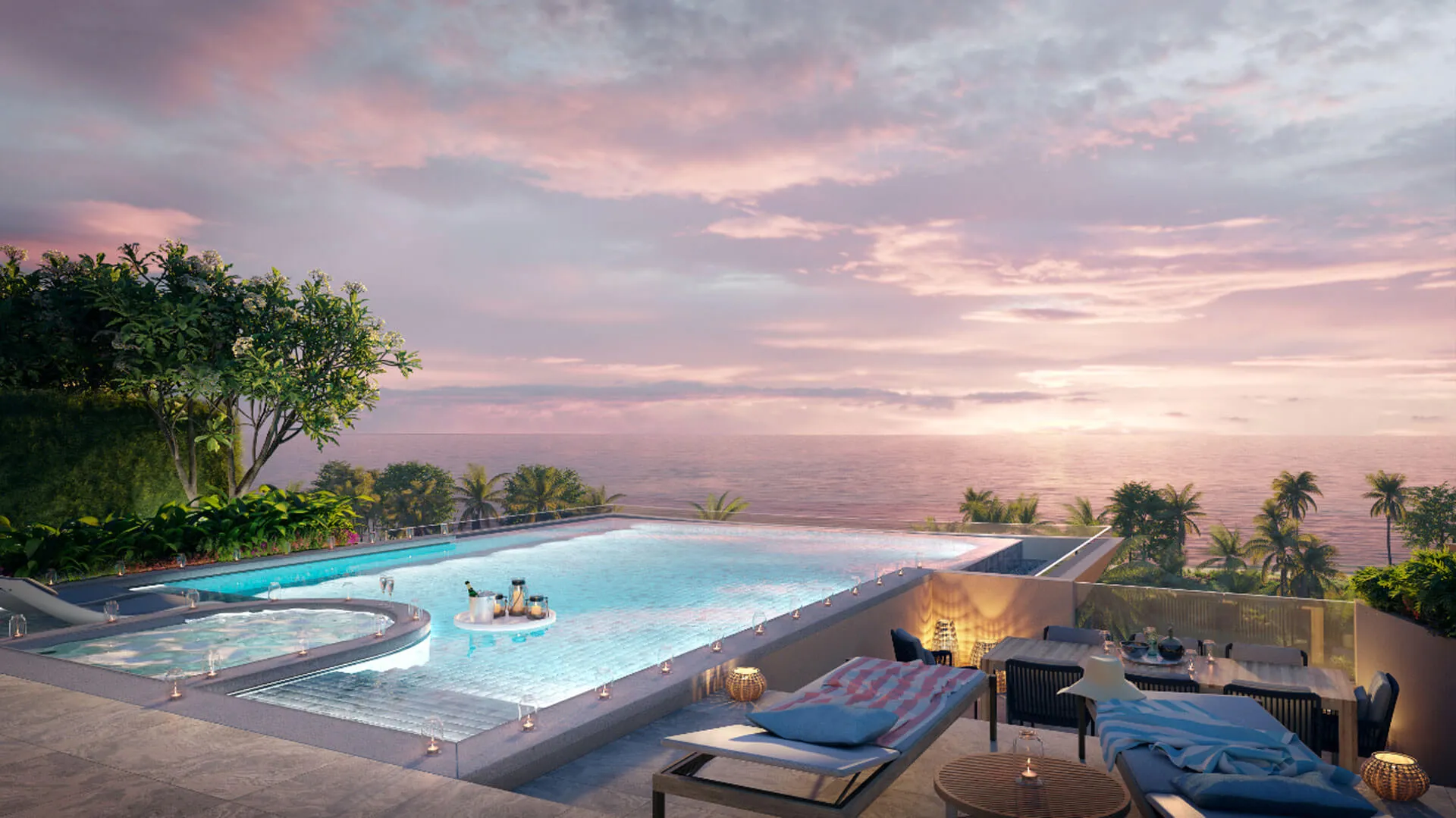 Banyan Tree Beach Residences Sirena - An infinity pool overlooks a serene ocean at sunset, with lounge areas and lush greenery surrounding it.