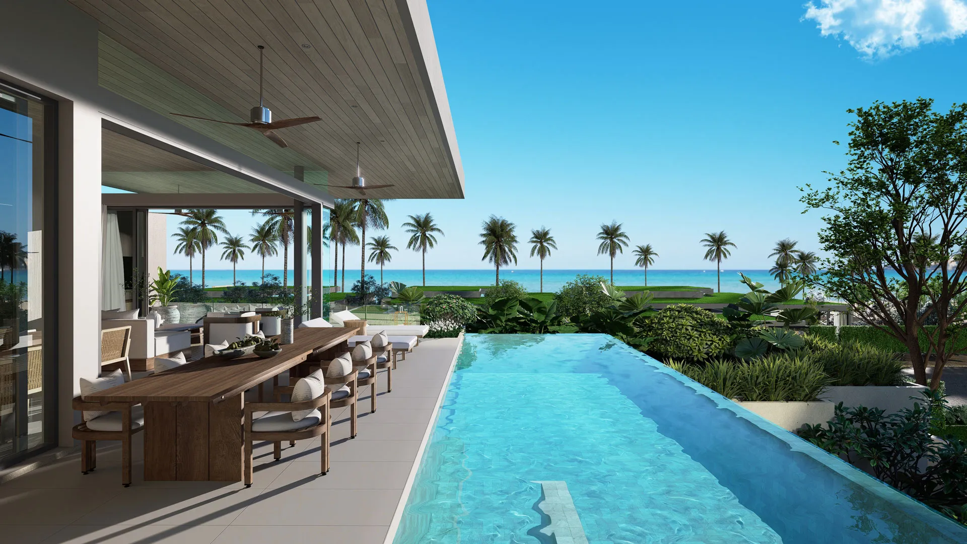 บันยันทรี เรสซิเดนซ์ สิชล - Open patio with a dining area and pool overlooking a tropical beach with palm trees and clear skies.
