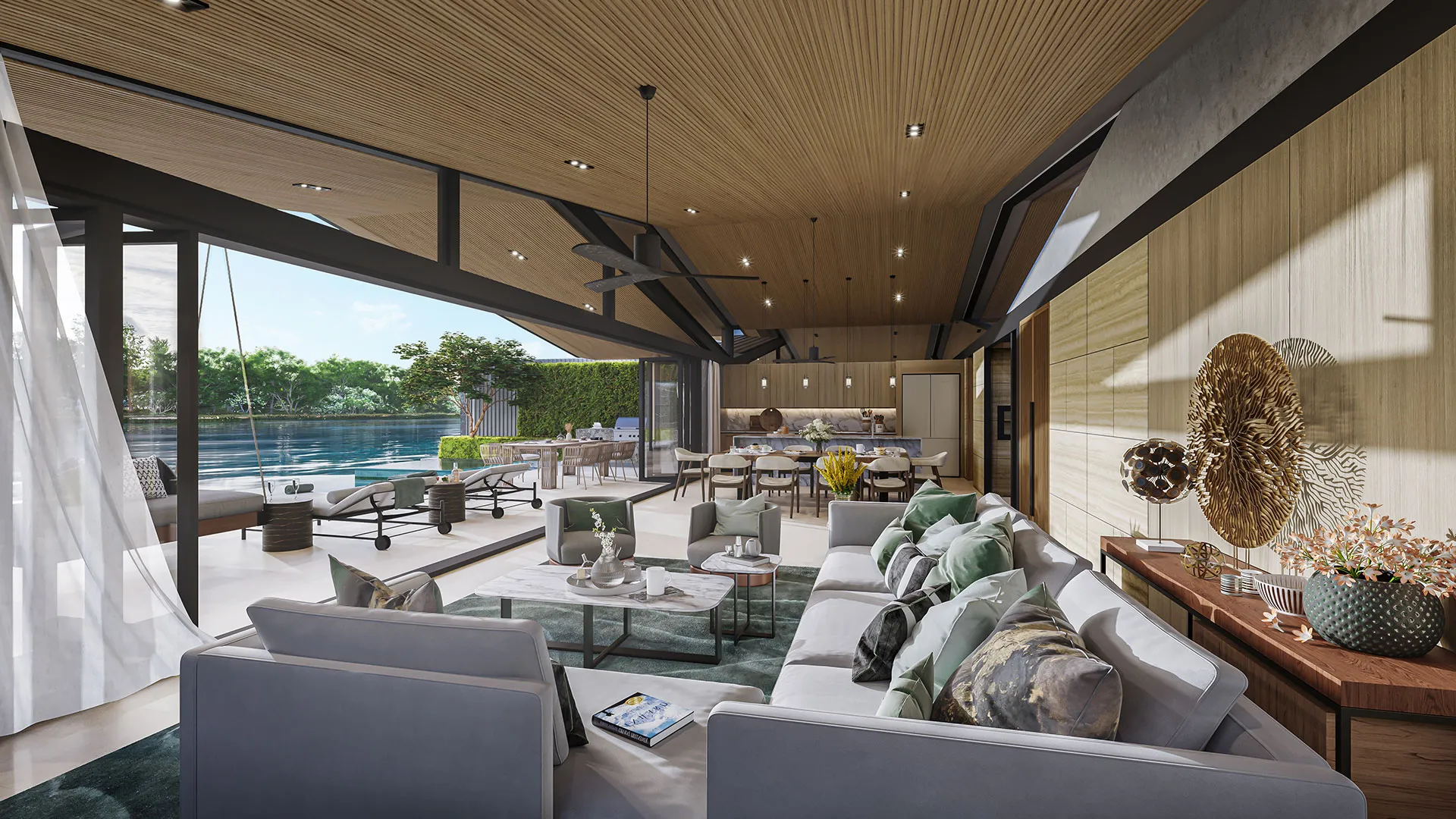 Laguna Lakelands Waterfront Villas - A luxurious open-plan living space seamlessly transitions to an outdoor pool area framed by lush greener.