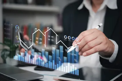 An investor reviewing Phuket real estate investment and rental yield data using a digital stylus