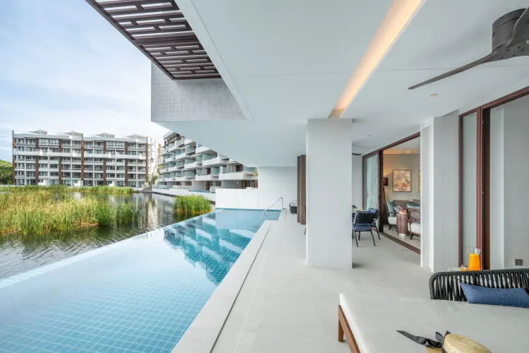 Stylish lounge area connected to an outdoor terrace in a private pool condominium Phuket unit