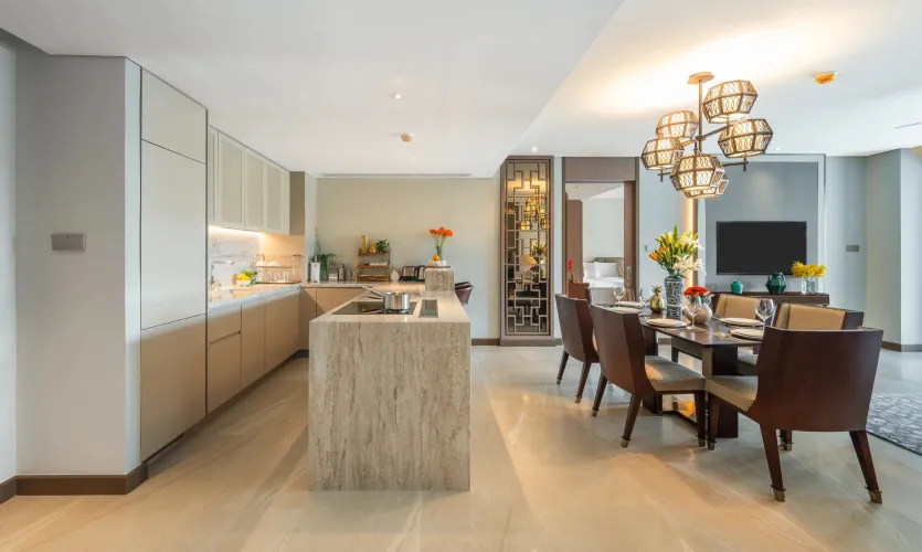 Open-plan dining and kitchen area inside private pool condominiums in Phuket with contemporary finishes