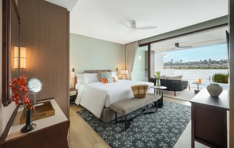 Bright bedroom with balcony and ocean-facing views inside Phuket ocean view penthouses